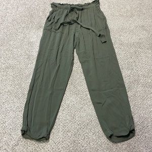 Know One Cares green trash bag pants